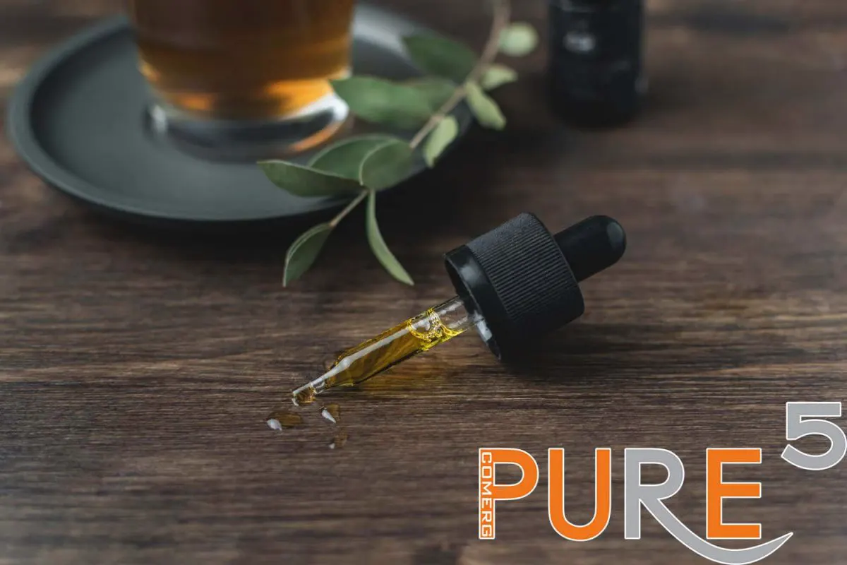 pure and clean hemp oil on a brown wooden table